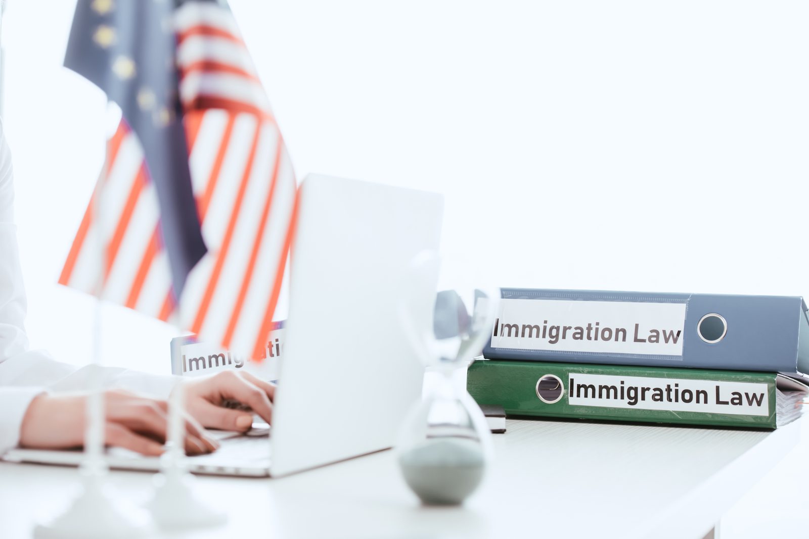 Immigration law documents arranged on the American flag